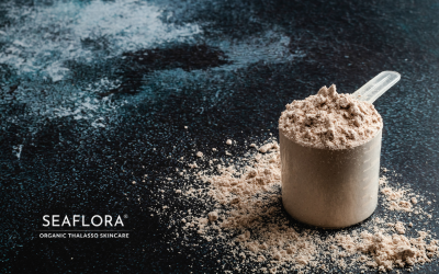 A scoop of protein shake powder symbolizing collagen support for healthy skin, with Seaflora Skincare logo included.