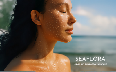 Woman with misty, dewy skin standing on a sunlit beach, embodying hydration and natural ocean beauty, with the Seaflora Skincare logo in white in the corner.
