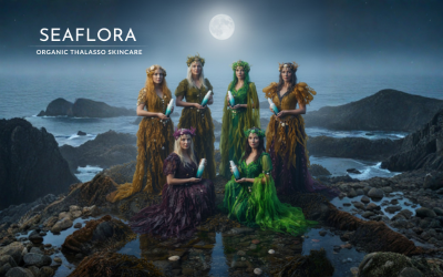 Six sea witches dressed in seaweed, holding Seaflora bottles under moonlight at low tide on a Vancouver Island beach, with Seaflora logo.
