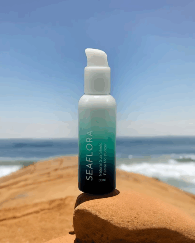 Seaflora Natural Sun Shield on Beach with Ocean Background - Seaflora Skincare Seaflora's Natural Sun Shield