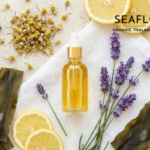 Flat lay of an amber dropper bottle surrounded by lemon slices, lavender sprigs, chamomile flowers, and dried seaweed strips on a marble background, with the Seaflora Organic Thalasso Skincare logo.